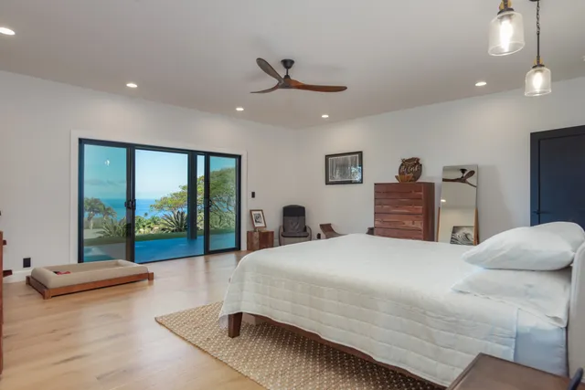a white bath tub sitting next to a white toilet