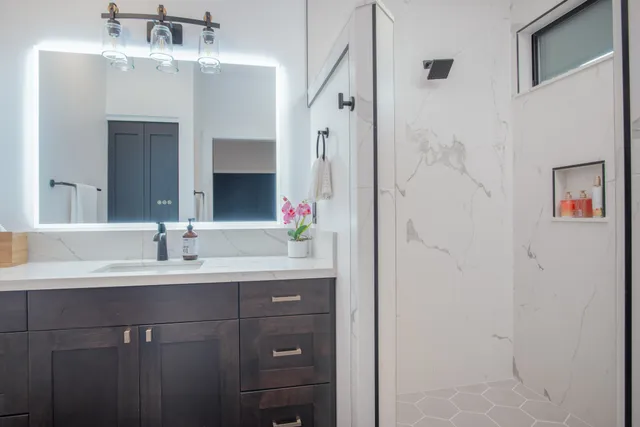 a bedroom with a bed and a painting