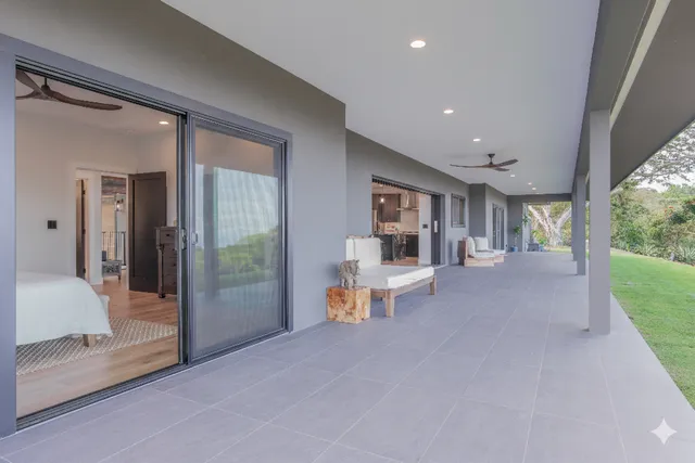 a view of a house with a yard and sitting area