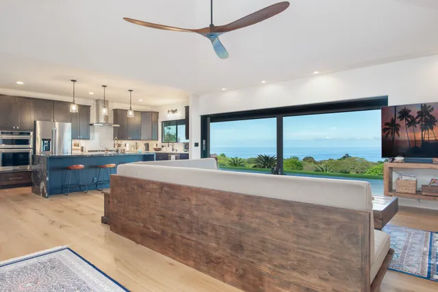 a view of a living room and a large window