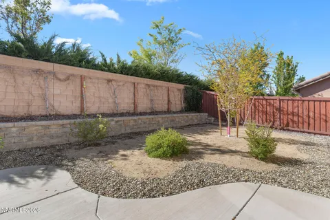 a view of a backyard of the house