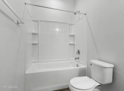 a bathroom with a sink a mirror and shower