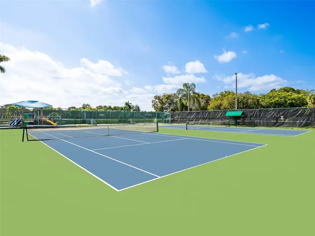 a view of an outdoor space and tennis court