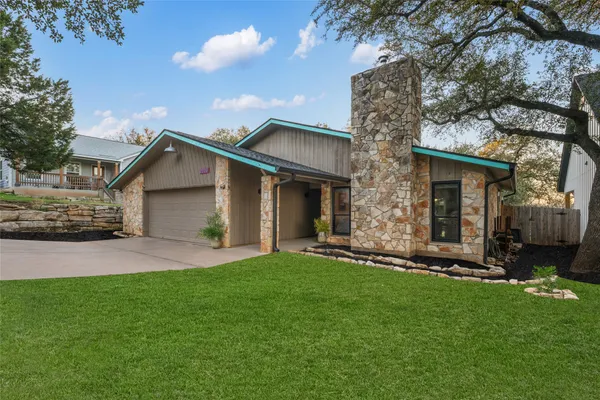 front view of a house with a yard