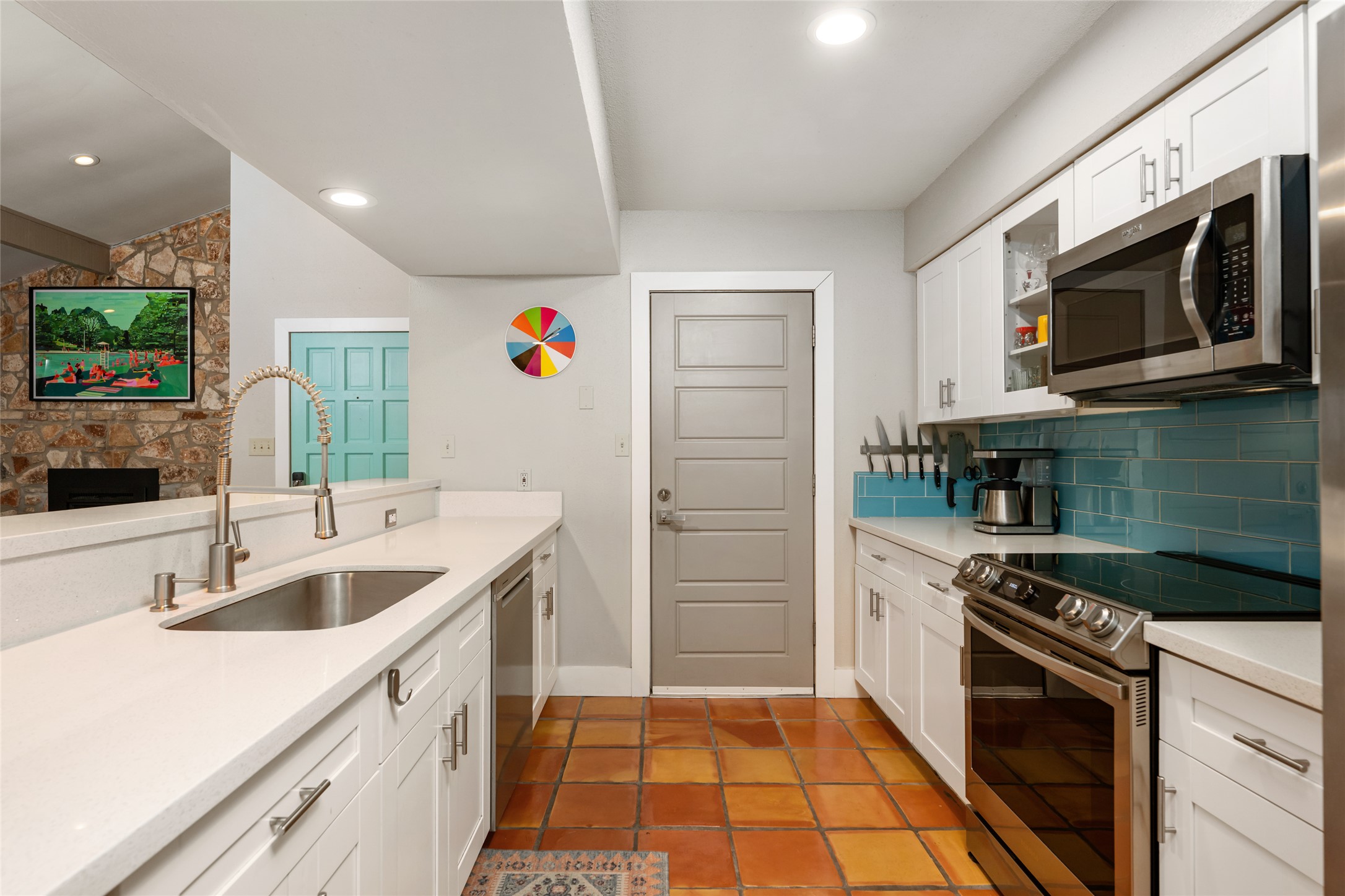 2210 Red Fox Road Austin, TX 78734 - Photo 11 of 40 a kitchen with a sink stove and microwave