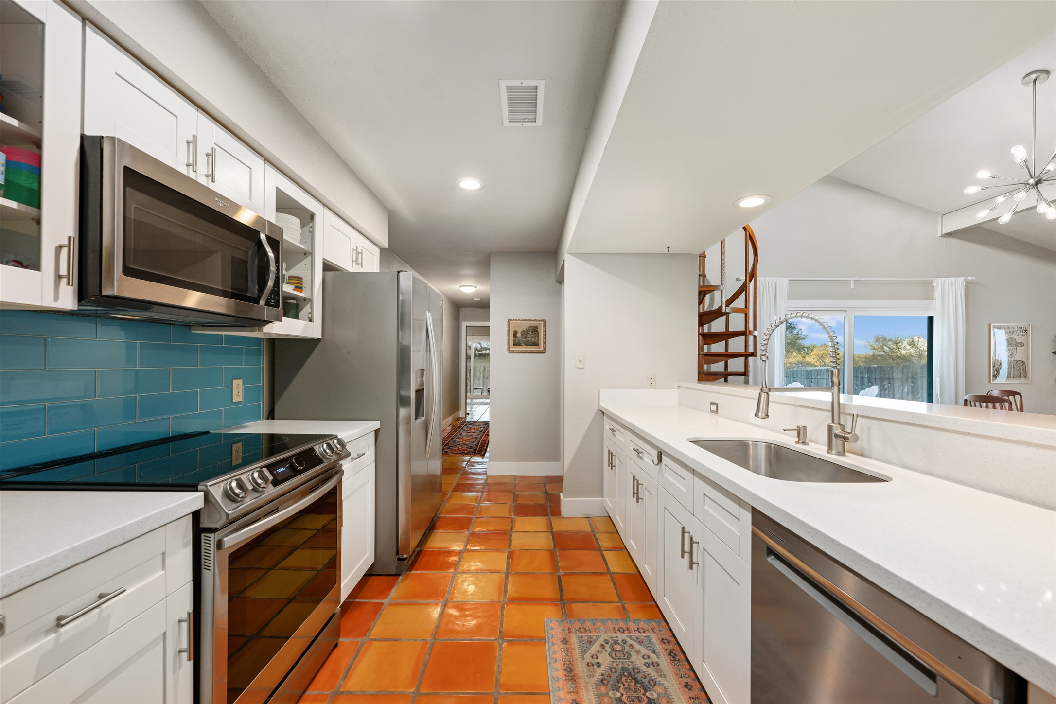2210 Red Fox Road Austin, TX 78734 - Photo 12 of 40 a kitchen with stainless steel appliances a sink stove and refrigerator