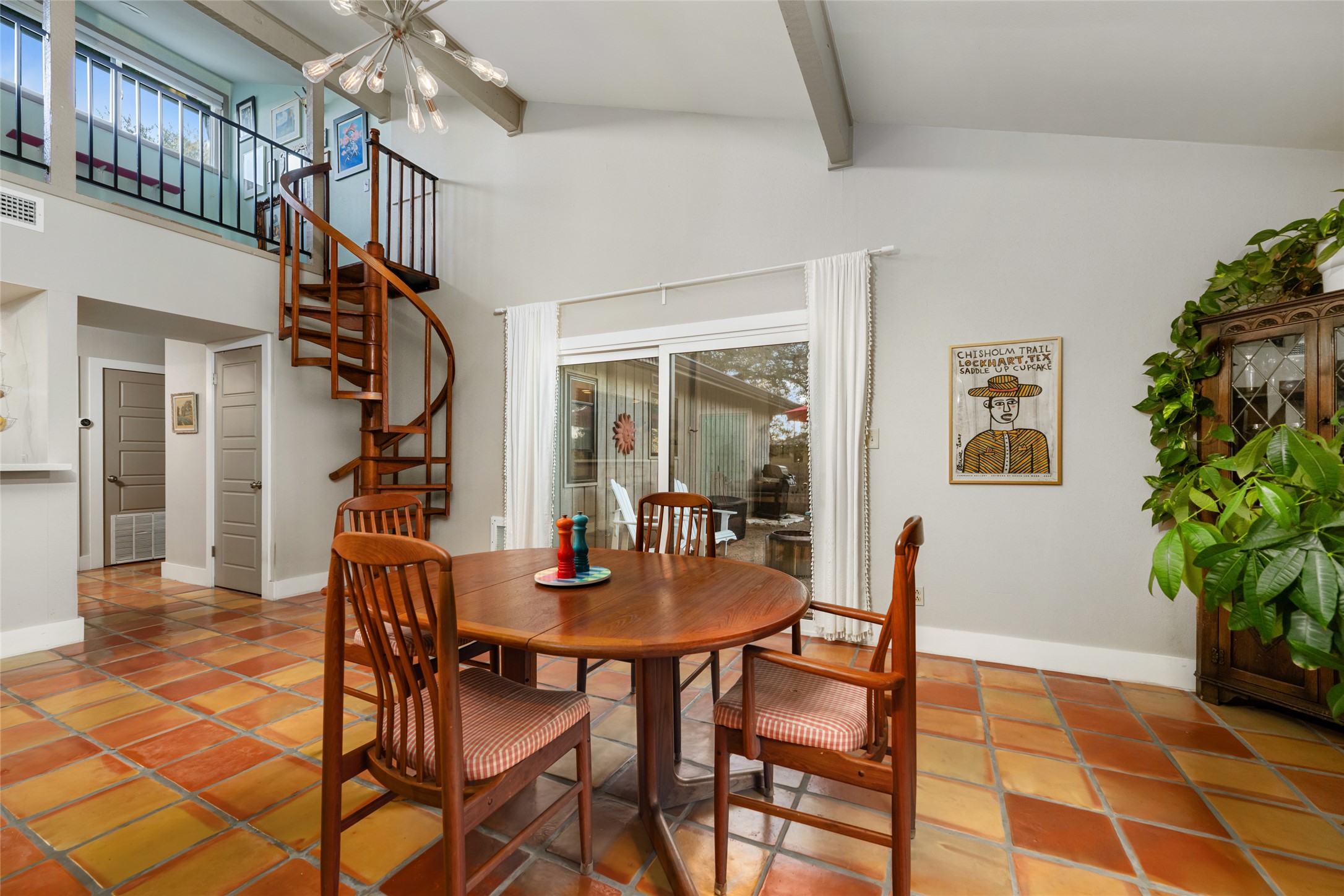 2210 Red Fox Road Austin, TX 78734 - Photo 13 of 40 a dining room with furniture and a potted plant