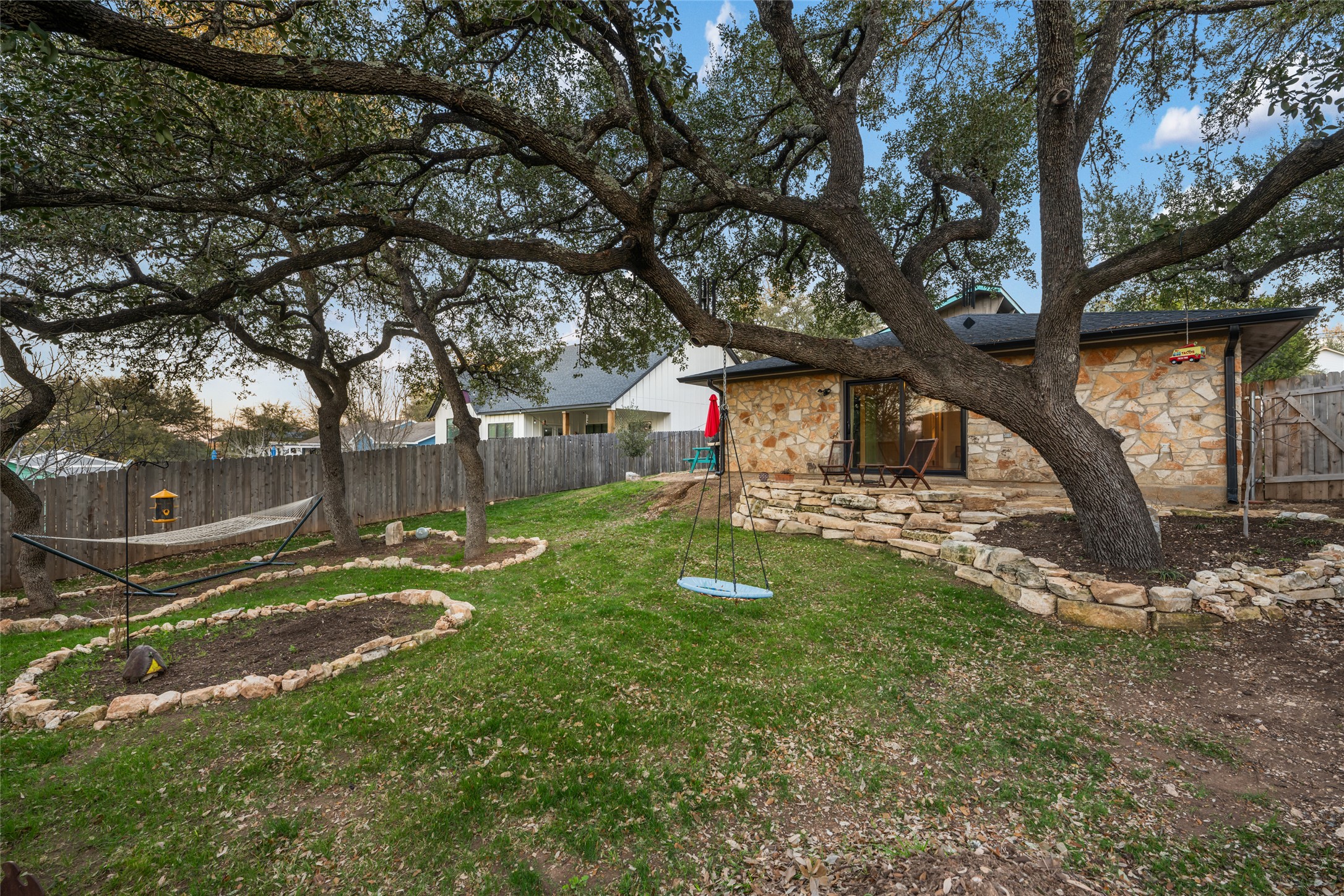 2210 Red Fox Road Austin, TX 78734 - Photo 17 of 40 a view of a tree in front of a house