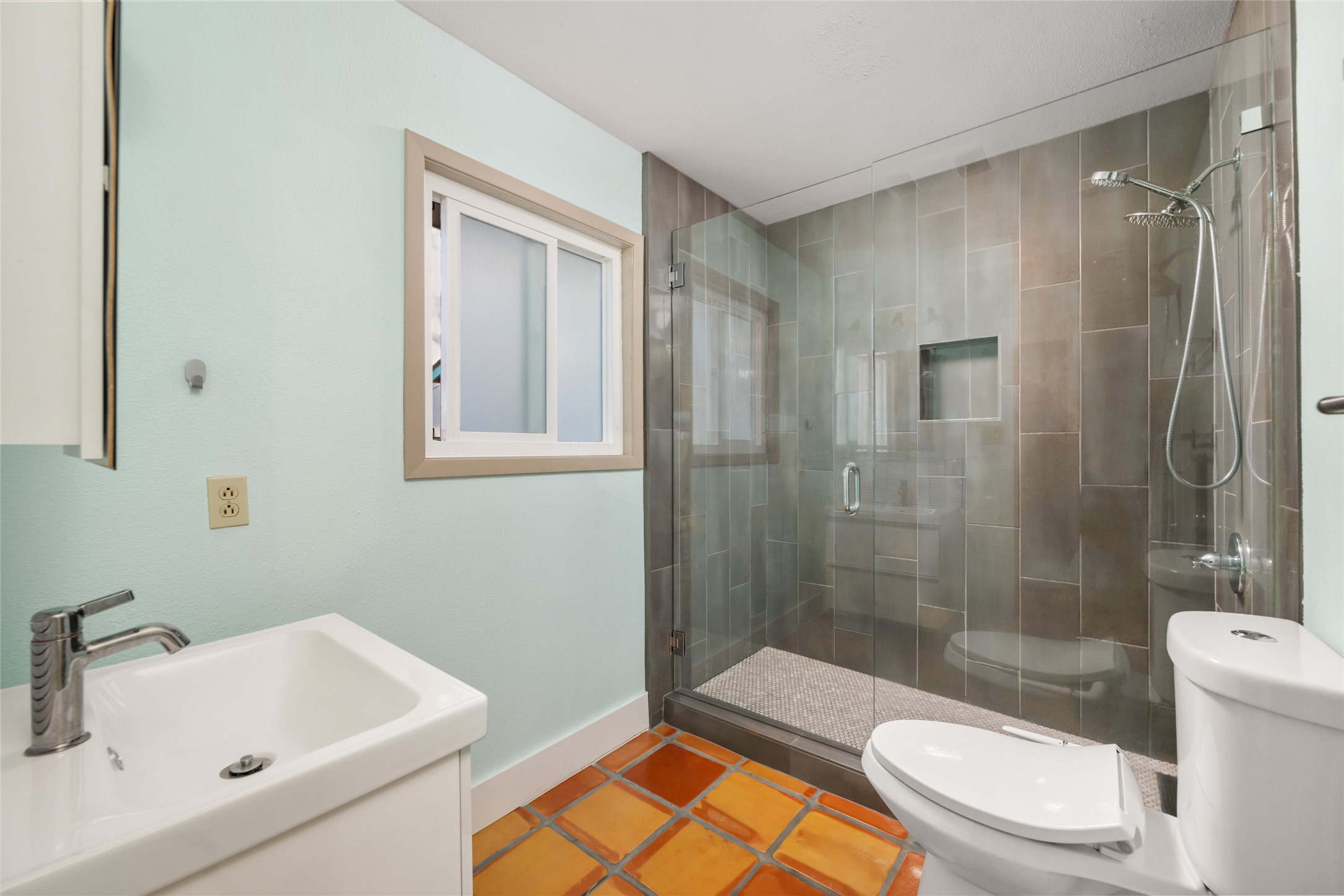 2210 Red Fox Road Austin, TX 78734 - Photo 24 of 40 a bathroom with a sink toilet and shower