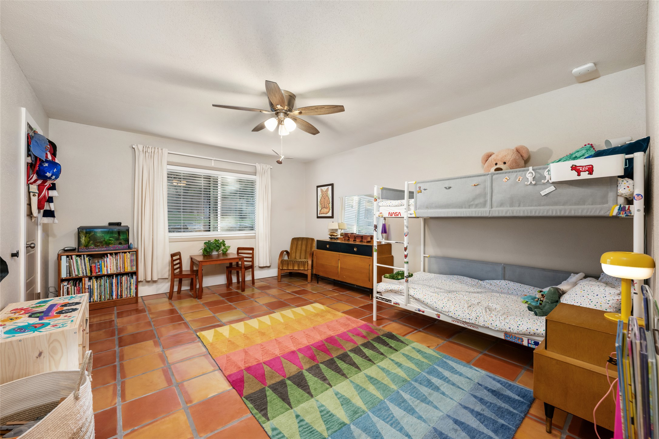 2210 Red Fox Road Austin, TX 78734 - Photo 25 of 40 a bedroom with furniture and a wooden floor
