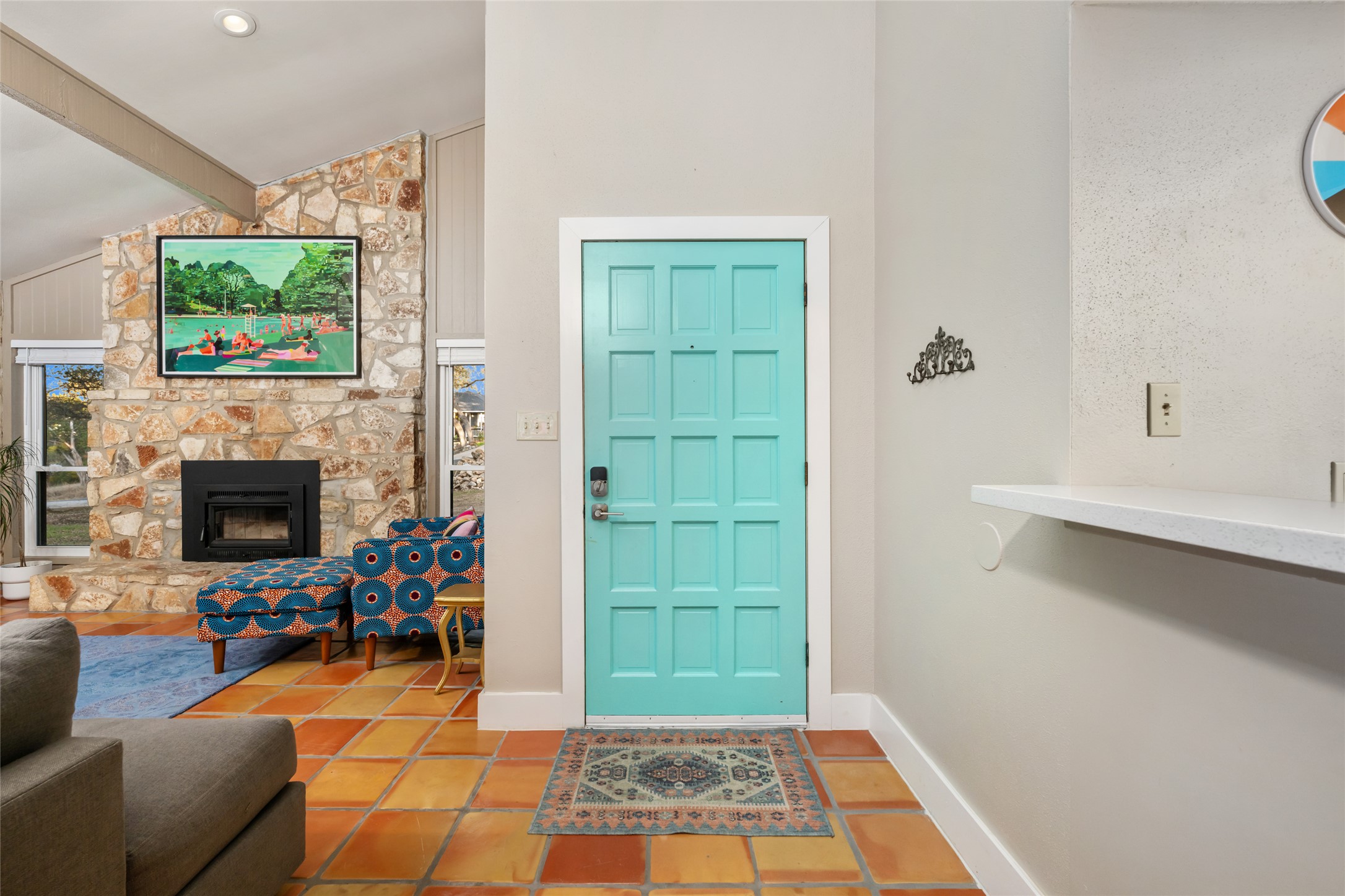 2210 Red Fox Road Austin, TX 78734 - Photo 4 of 40 a living room with furniture a flat screen tv and a fireplace