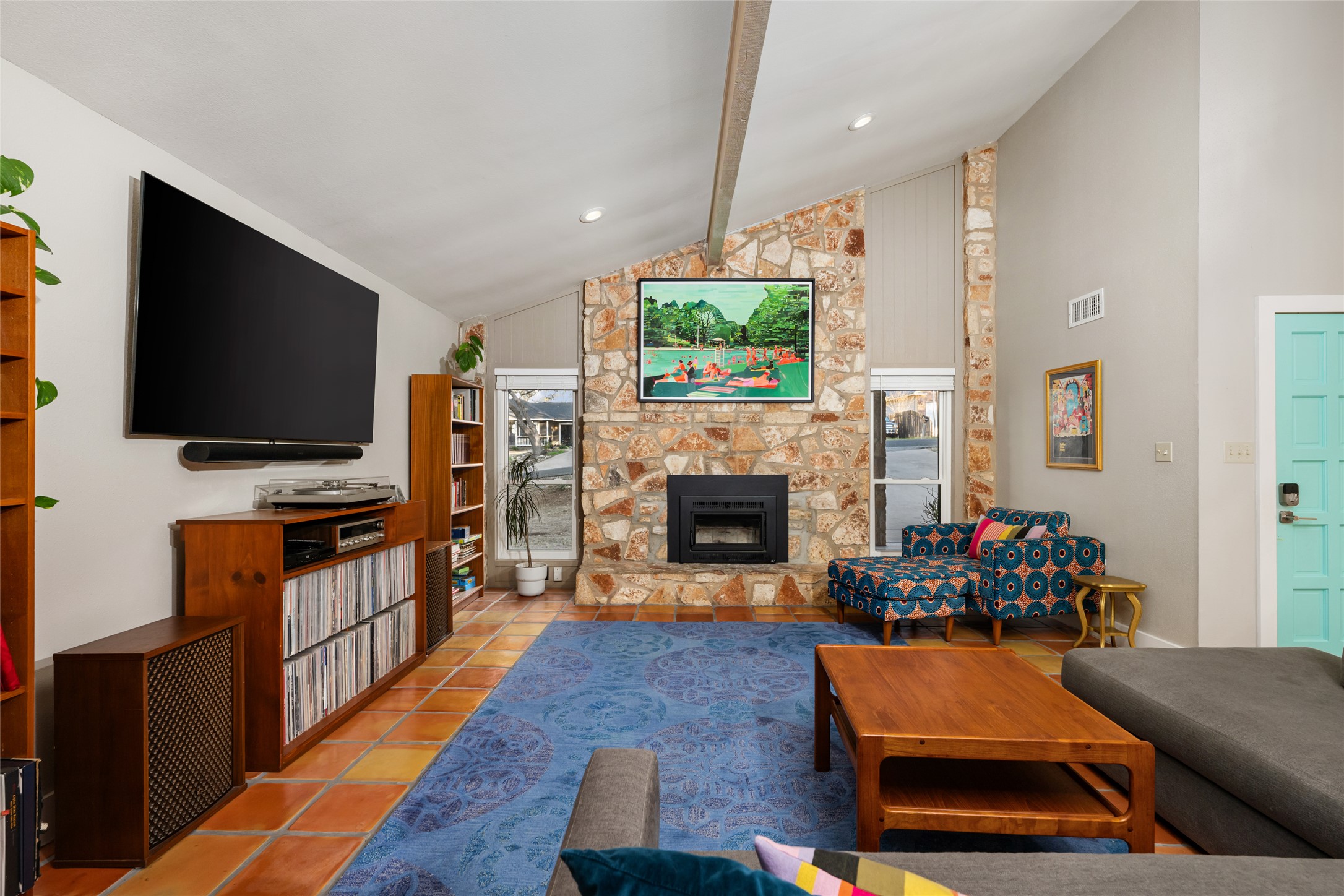 2210 Red Fox Road Austin, TX 78734 - Photo 5 of 40 a living room with furniture a flat screen tv and a fireplace