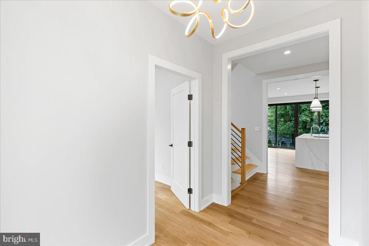 71 Maple Street Princeton, NJ 08542 - Photo 11 of 68 a view of a hallway with wooden floor and staircase