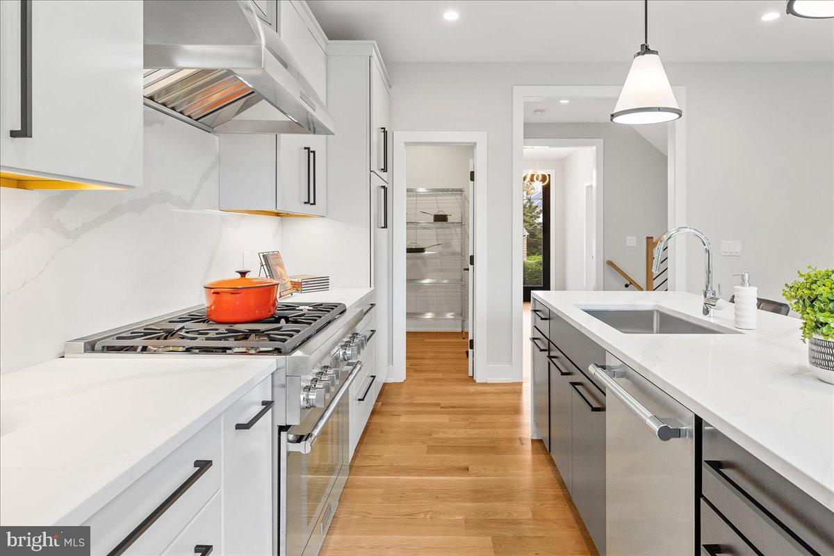 71 Maple Street Princeton, NJ 08542 - Photo 12 of 68 a kitchen with stainless steel appliances a sink stove and cabinets