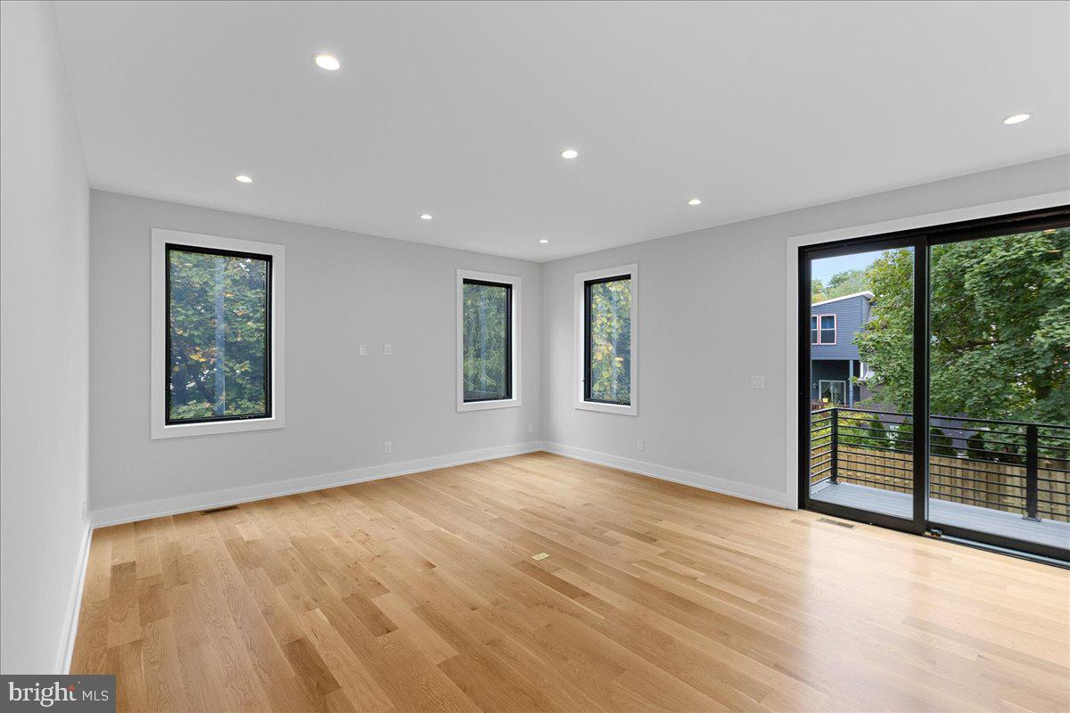 71 Maple Street Princeton, NJ 08542 - Photo 13 of 68 a view of an empty room with wooden floor and a window
