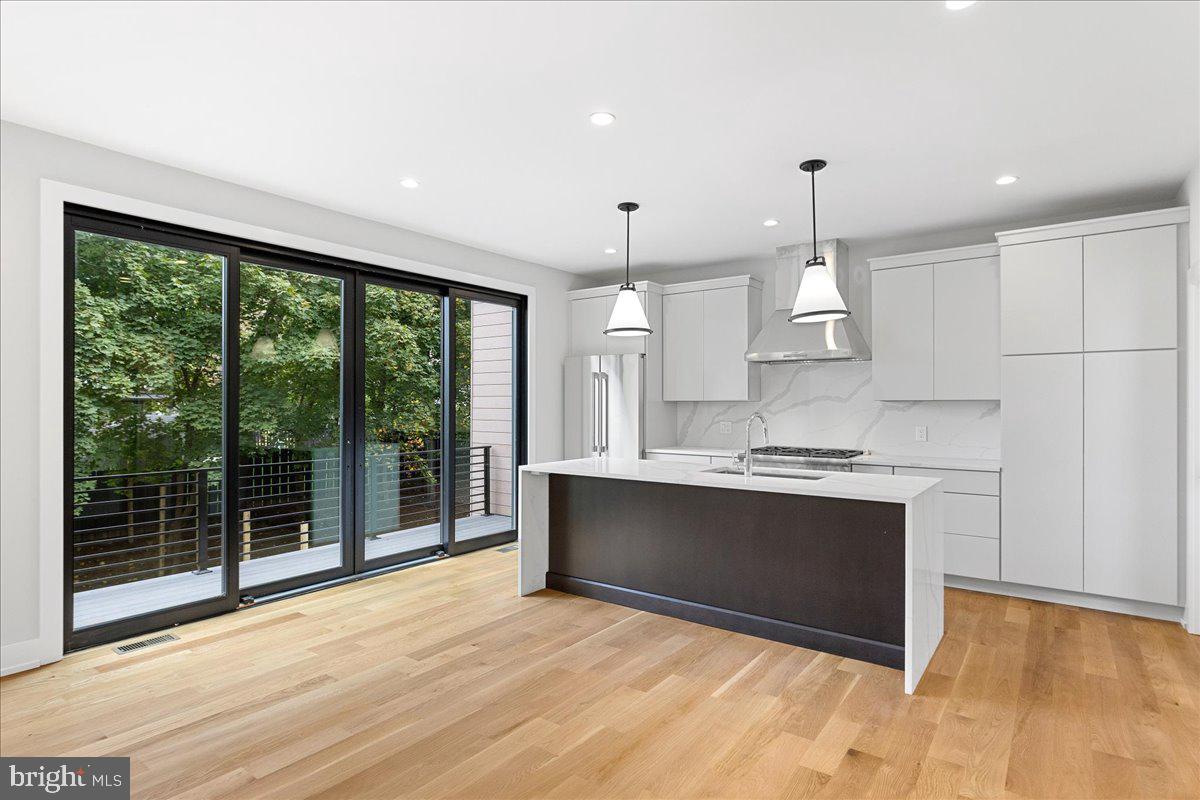 71 Maple Street Princeton, NJ 08542 - Photo 15 of 68 a view of kitchen with stainless steel appliances granite countertop sink stove and refrigerator