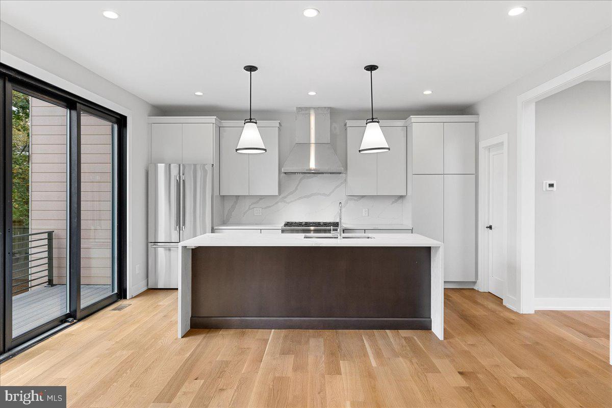 71 Maple Street Princeton, NJ 08542 - Photo 16 of 68 a view of kitchen with stainless steel appliances granite countertop cabinets and a wooden floor