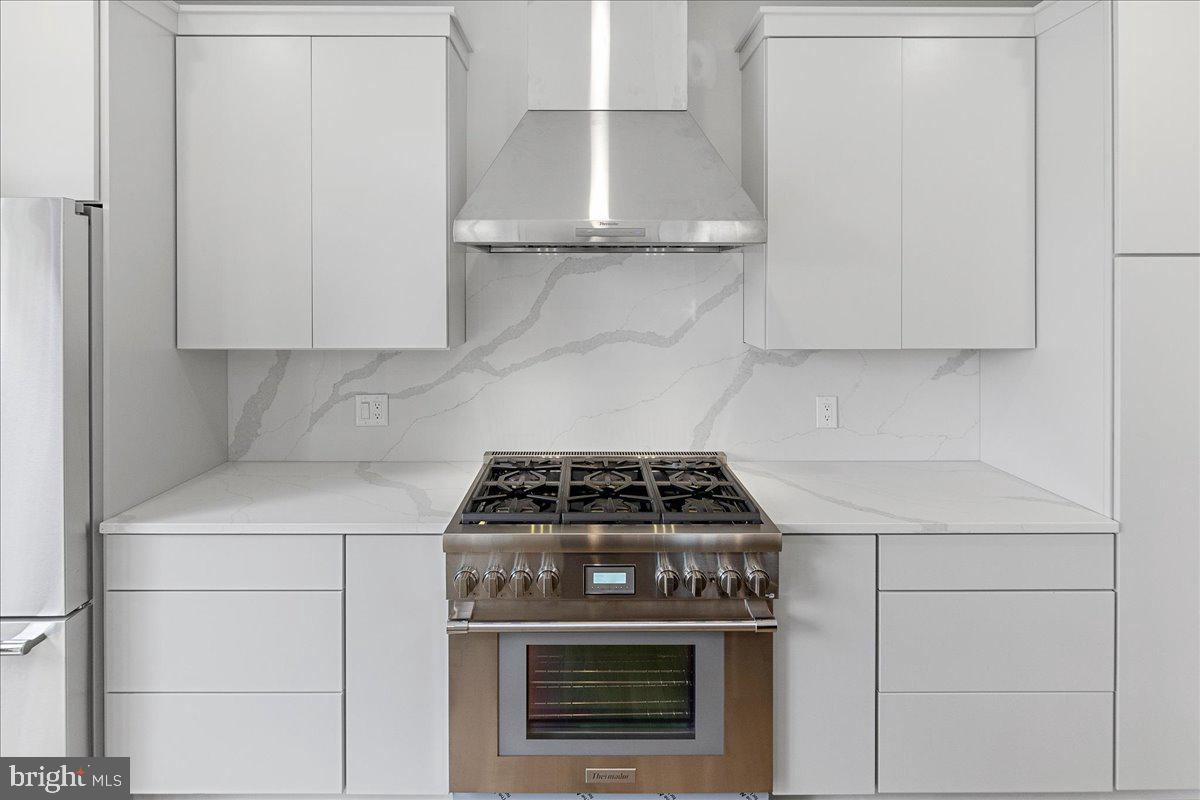 71 Maple Street Princeton, NJ 08542 - Photo 20 of 68 a stove top oven sitting inside of a kitchen