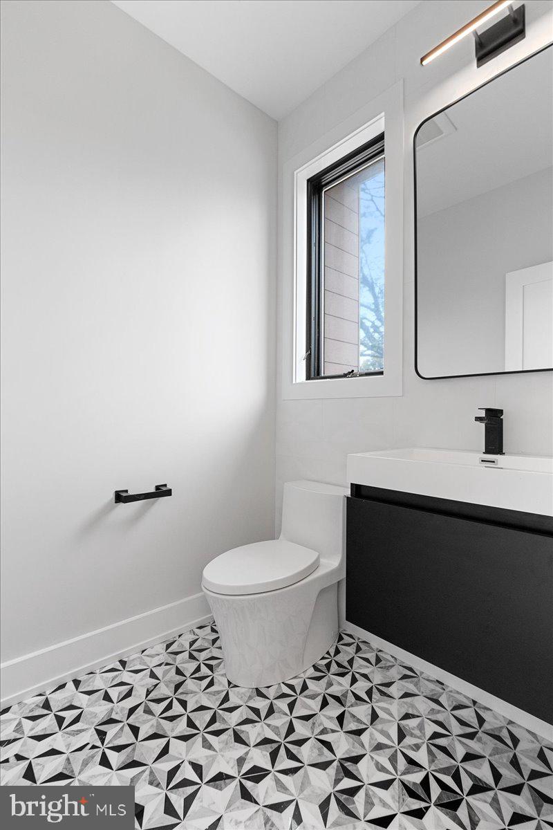 71 Maple Street Princeton, NJ 08542 - Photo 21 of 68 a bathroom with a sink toilet and vanity