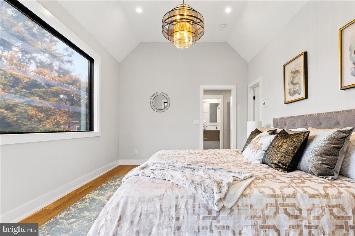 71 Maple Street Princeton, NJ 08542 - Photo 24 of 68 a bedroom with a bed and painting on the wall