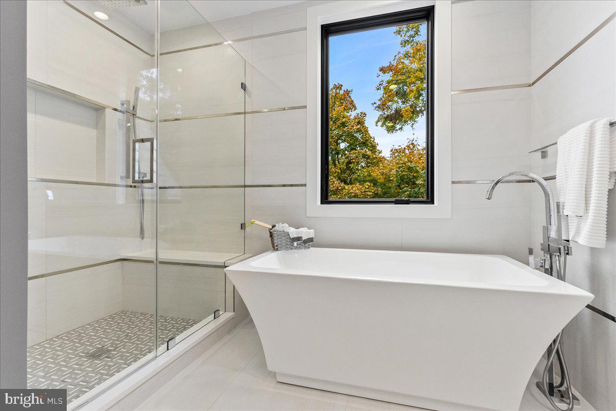 71 Maple Street Princeton, NJ 08542 - Photo 27 of 68 a bathroom with a bathtub and a shower