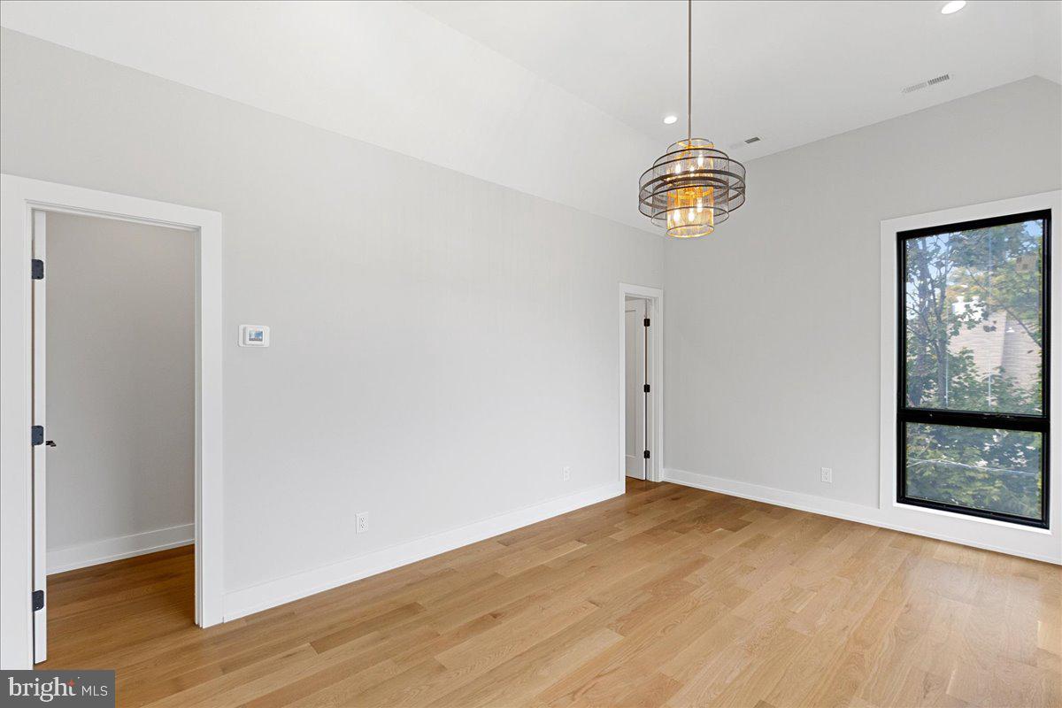 71 Maple Street Princeton, NJ 08542 - Photo 30 of 68 an empty room with wooden floor and windows
