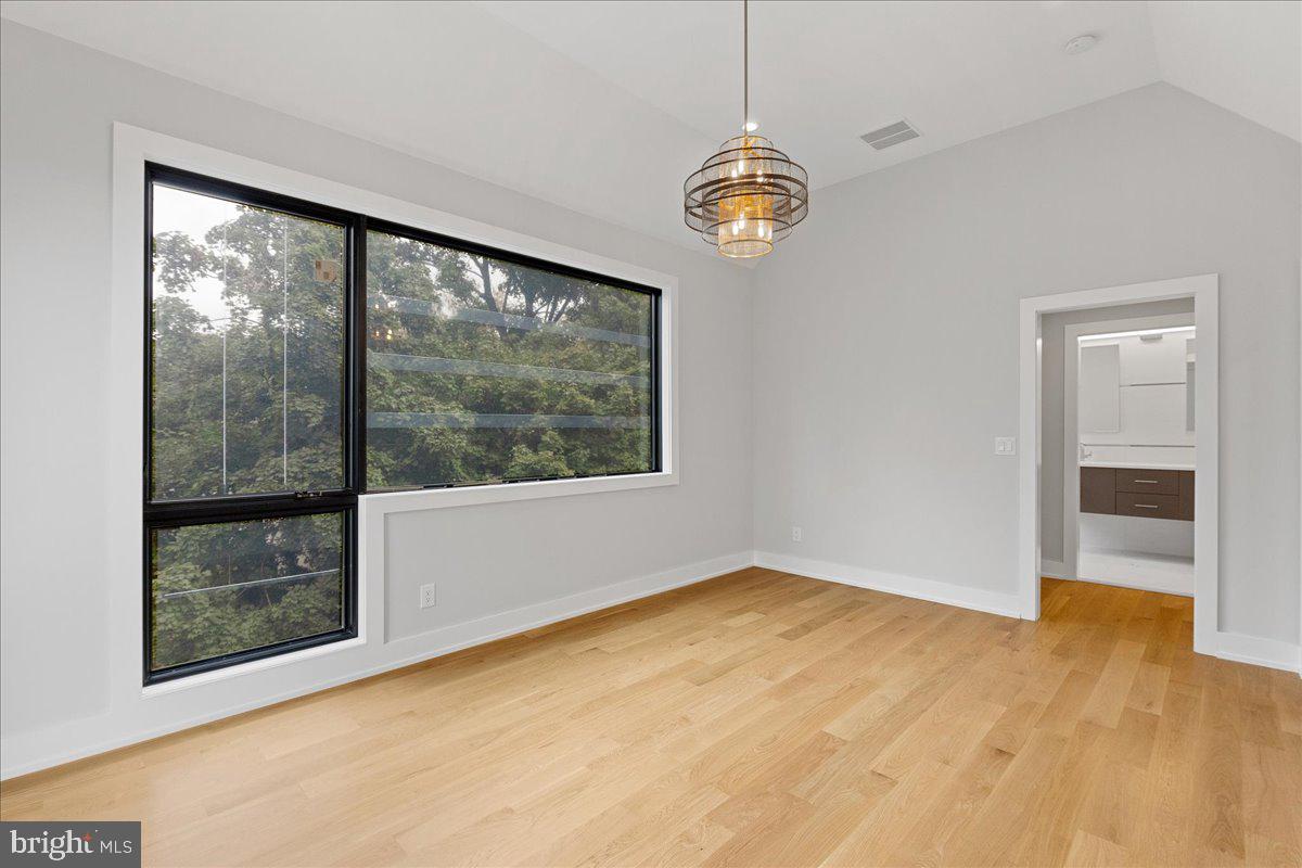 71 Maple Street Princeton, NJ 08542 - Photo 32 of 68 a view of empty room with a fireplace and large window