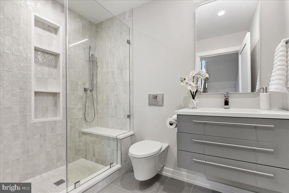 71 Maple Street Princeton, NJ 08542 - Photo 36 of 68 a bathroom with a toilet a sink and shower