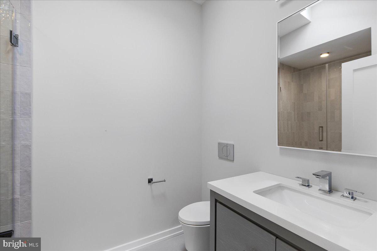 71 Maple Street Princeton, NJ 08542 - Photo 47 of 68 a bathroom with a sink toilet and vanity