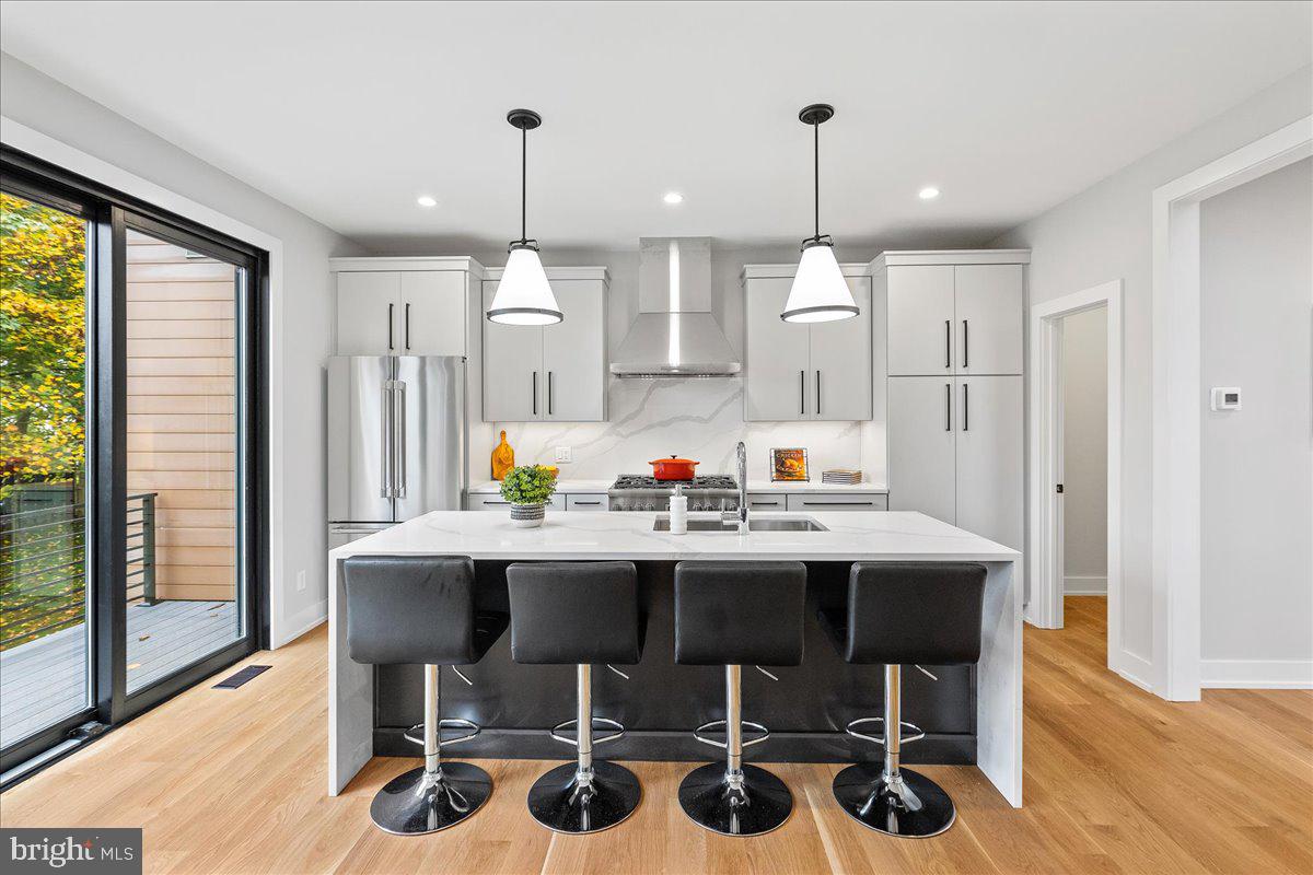 71 Maple Street Princeton, NJ 08542 - Photo 5 of 68 a view of a dining room and livingroom with furniture wooden floor a chandelier