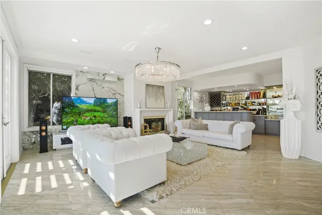 a living room with fireplace furniture and a fireplace