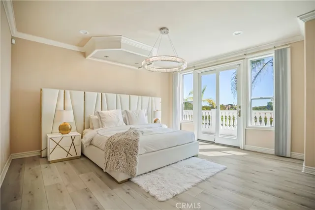 a living room with a bed furniture and a large window