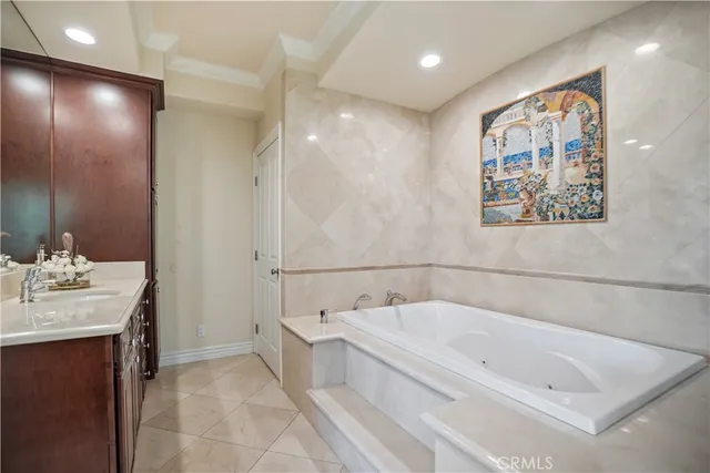 a bathroom with a bathtub and a sink