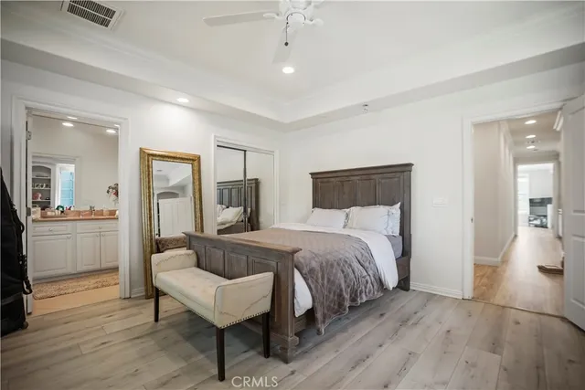 a spacious bedroom with a bed and a couch