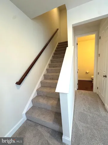 a view of a livingroom with a staircase
