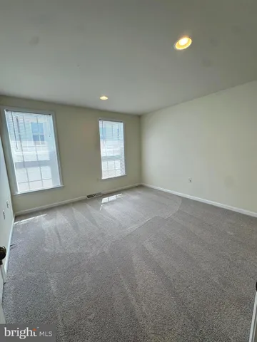 a bathroom with a toilet a sink and a mirror