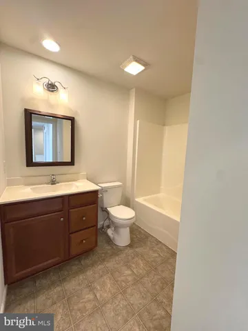 a view of an empty room and a window