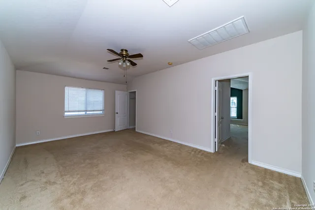 an empty room that has a window in it