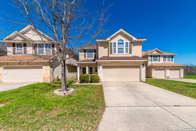 a view of house with yard and entertaining space