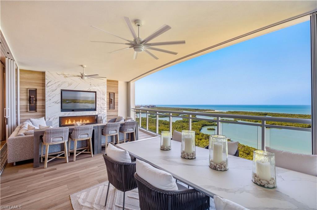13945 Old Coast Road, Unit PH05 Naples, FL 34110 - Photo 1 of 37 a view of a dining room with furniture window and outside view