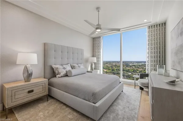 a bedroom with a large bed and a window