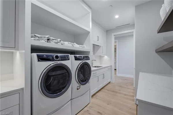 a view of washer and dryer in a utility room