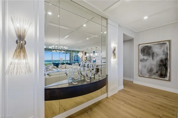 a view of living room and kitchen with wooden floor