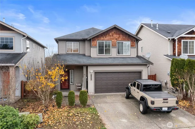 a front view of a house with parking