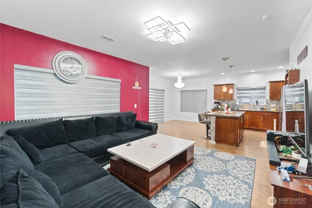 a living room with furniture and a table