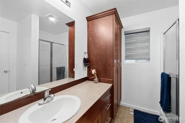 a bathroom with a sink and a mirror