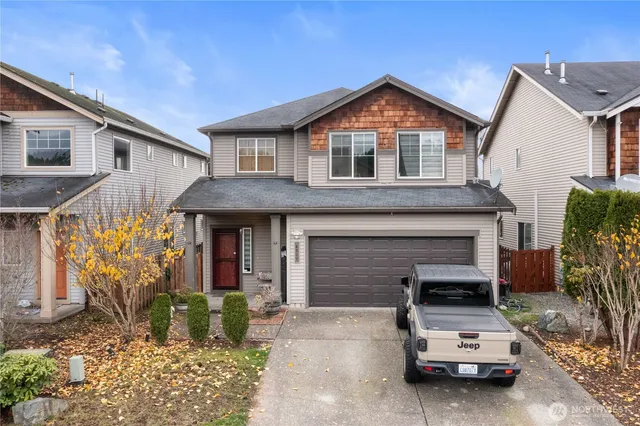 a view of a car park in front of house