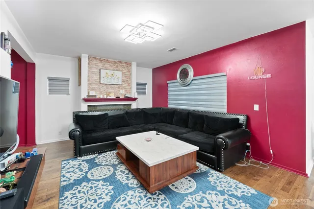 a living room with a couch and a flat screen tv