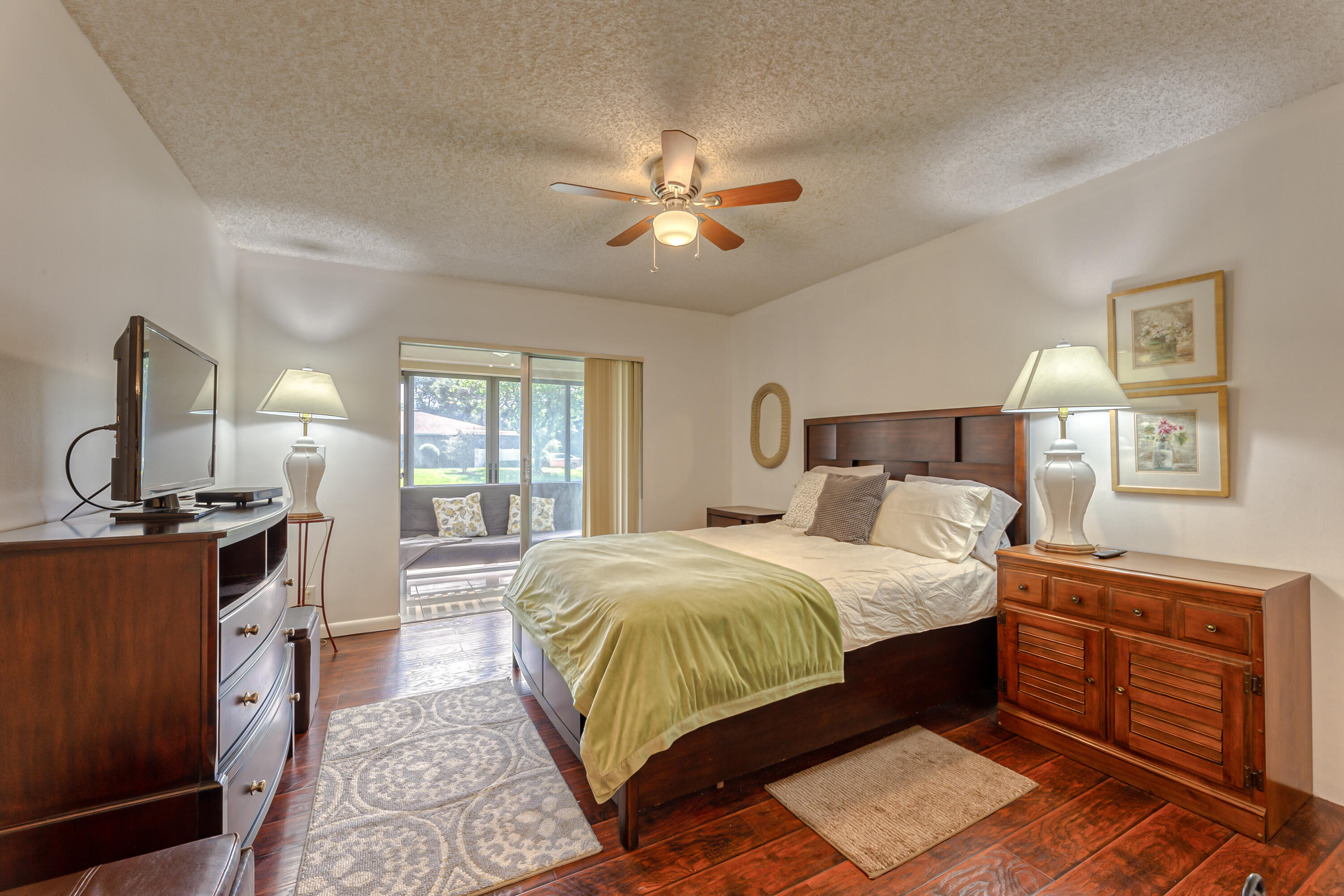 8916 Rheims Road Boca Raton, FL 33496 - Photo 16 of 31 a bed room with a bed and a dresser