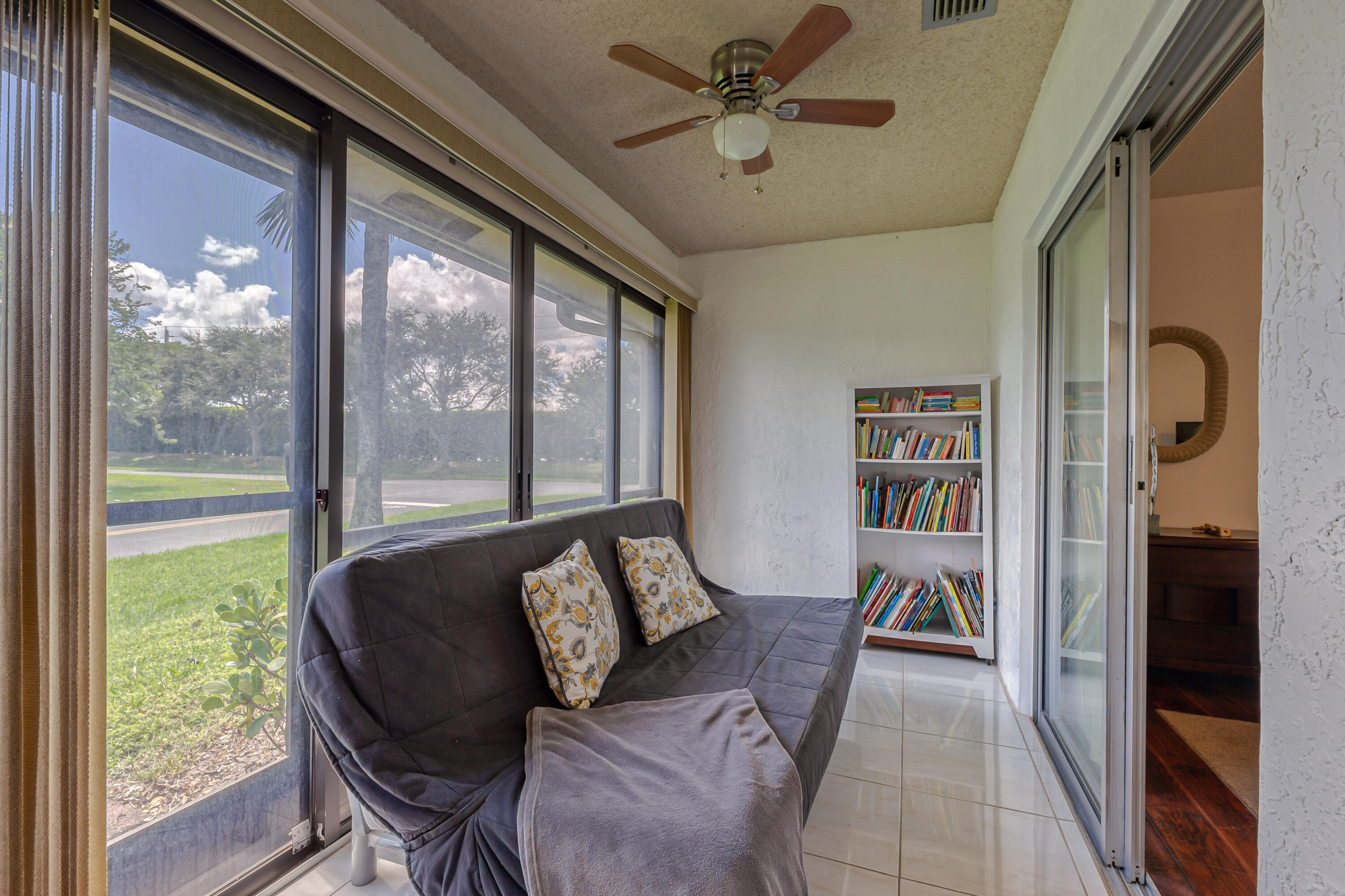 8916 Rheims Road Boca Raton, FL 33496 - Photo 20 of 31 a living room with furniture and a large window